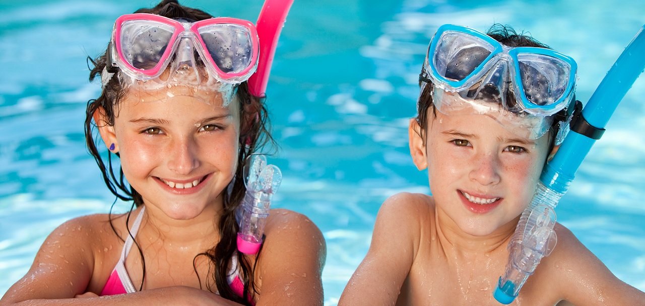 Kids in pool with goggles