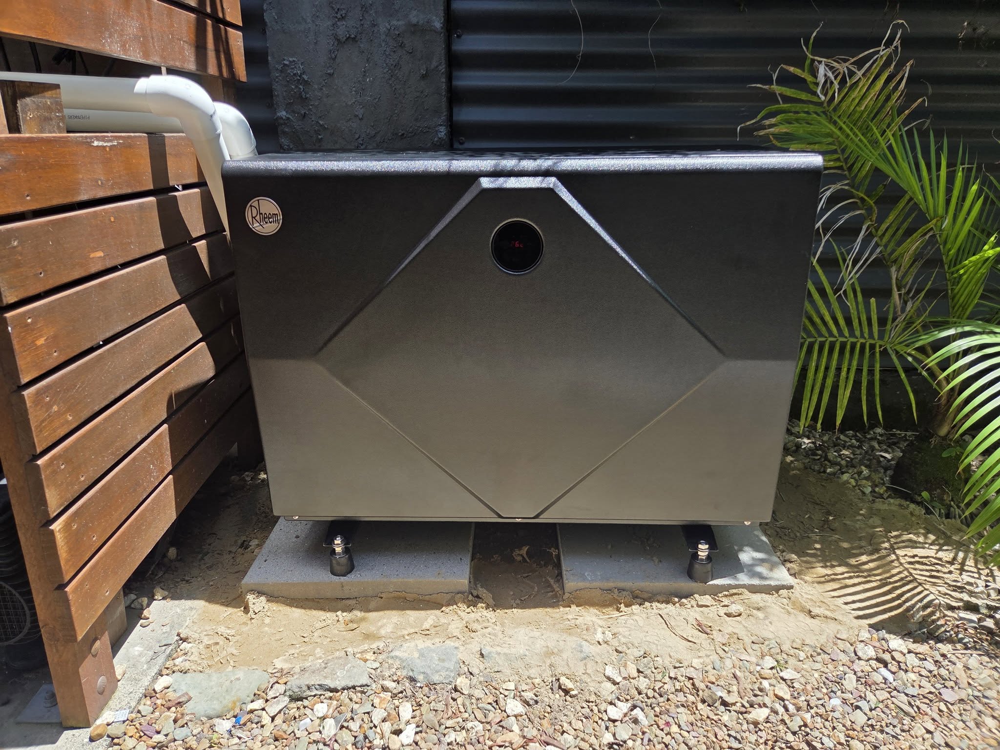 Front view of installed Rheem pool heater